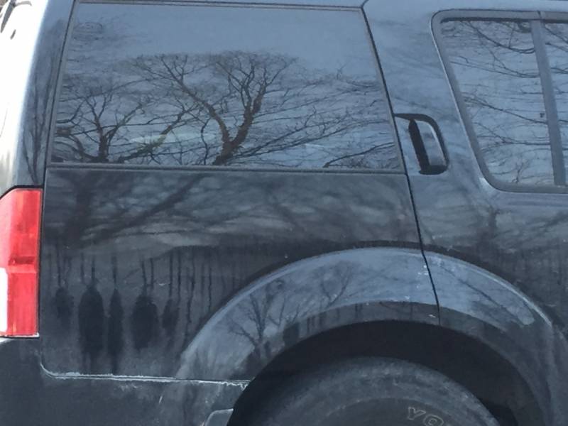 "Strange dirt formation on my car looks like people hanging"
